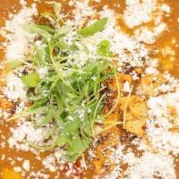 Chicken Tortilla · This chicken tortilla soup is mildly spicy with navy, pinto and kidney beans, corn and sweet...
