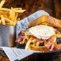 Hangover Burger · Fried egg, applewood smoked bacon, crispy fries, beer cheese sauce on toasted thick texas to...