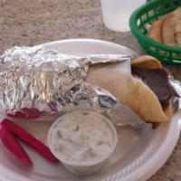 Gyro Sandwich · Greek flat bread, gyro, salad, tzatziki.