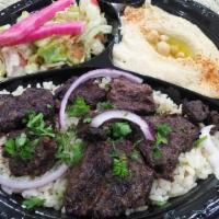 Shish/Beef Kabob Plate · Gluten free. Marinated steak grilled on a skewer. Served with rice, salad, hummus, and pita ...