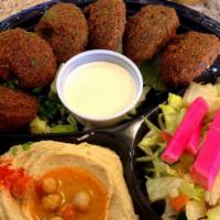 Falafel Plate · Fried vegetarian fritters, served with tahini. Served with, salad, hummus, and pita bread.