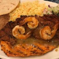 Fajita De Res · Sautéed with sliced onion, tomato and green pepper accompanied with rice, refried beans and ...
