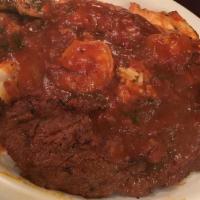 Asado Latino · Chorizo, carne asada, chicken breast, fish fillet, and shrimp topped a sauce over rice accom...