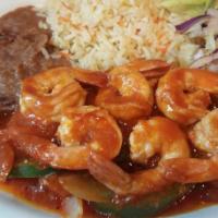 Camarones Emtomado · Sauteed shrimps in tomato sauce with green pepper, onion, and tomato accompanied with rice, ...