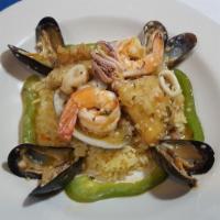 Mariscada Al Sarten · Seafood sauteed. Sauteed shrimps, squid, calamari, mussels, fish fillet, and scallops in gar...