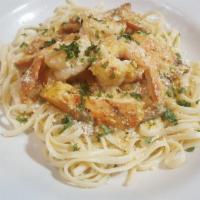 Pasta Camarones Con Pollo · Broiled chicken breast strips with sauteed shrimps in creamy mushroom sauce. Served over lin...