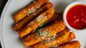 Mozzarella Fritti · Fresh-cut wisconsin mozzarella, lightly breaded and fried to a golden brown. Served with rus...
