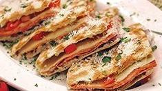 Flatbread Italian Deli Sandwich · Prosciutto, soppressata di salami, mortadella ham, provolone cheese, romaine lettuce, red on...