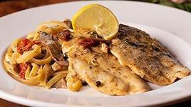 Chicken Piccata · Lightly floured and sautèed chicken with portabella mushrooms, capers, and sun-dried tomatoes in white wine lemon garlic sauce. Served over fettuccine pasta.
