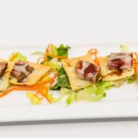 Ahi Tuna Bites · On wontons, with wasabi vinaigrette and teriyaki reduction sauce