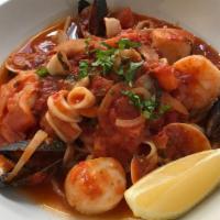 Lobster Fra Diavolo · Lobster, shrimp, scallops, mussels, calamari, clams, spicy marinara sauce on a bed of linguini