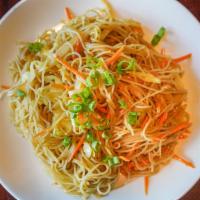 Singapore Style Noodles With Veggies Or Chicken · Rice noodles with yellow curry and sliced chicken and/or veggies
