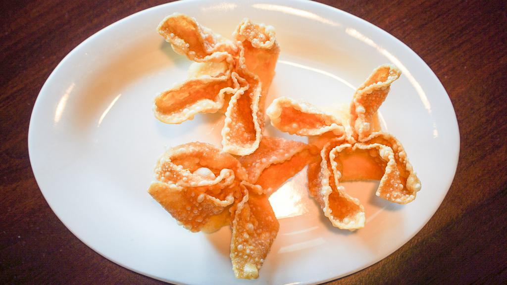 Crab Rangoon (3) · Deep fried imitation crab meat and cheese wrapped in wonton wrapper.