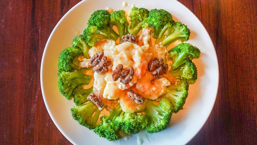 Walnut Shrimp (10) · 8 pieces of large shrimp deep fried with a tempura batter and tossed in creamy sauce and sweetened walnuts