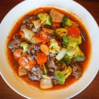 Beef W/ Hamiltonian Sauce · Sliced beef stir fired with Hamiltonia sauce, which is the sour, sweet, and spicy brown sauce.