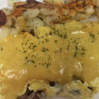 Roast Beef Supreme Omelet · Roast beef, sautéed onion, swiss cheese then topped with hollandaise sauce.