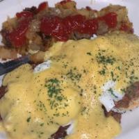 Hash Benedict · English muffin topped with corned beef hash, two poached eggs, and Hollandaise sauce. 
Serve...