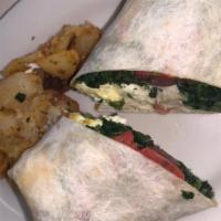 Grilled Veggie Wrap · A grilled assortment of grilled peppers, onions, mushrooms, and broccoli topped with provolo...