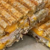 Grilled Turkey Cheese Sandwich · Premium turkey breast served with Sharp Cheddar and Monterey Jack cheeses on sourdough bread...
