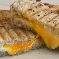 Grilled Cheese Sandwich · A delicious blend of Sharp Cheddar and Monterey Jack cheeses on sourdough bread, topped with...