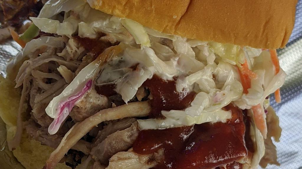 Pulled Pork · Our smoked pulled pork is cooked slow and low served in its juicy goodness with your choice of sauces. We recommend either Kansas City or Carolina.