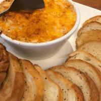 Canton Crab Dip · Rich, creamy, cheesy, and crabby goodness. Served with crostini bread.