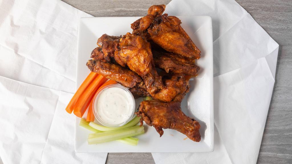 Tc'S Wings · Bone-In or Boneless wings marinated, fried and tossed in your choice wing sauce, served with blue cheese or ranch dressing, celery and carrot.