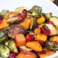 Butternut Brussels Sprouts · Crispy Brussels sprouts prepared with butternut squash and tossed in our house-made cranberr...