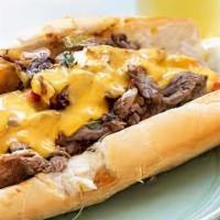 Philly Cheesesteak · Sliced ribeye steak, melted cheese, grilled onions, roasted peppers, sauteed mushrooms, hoag...