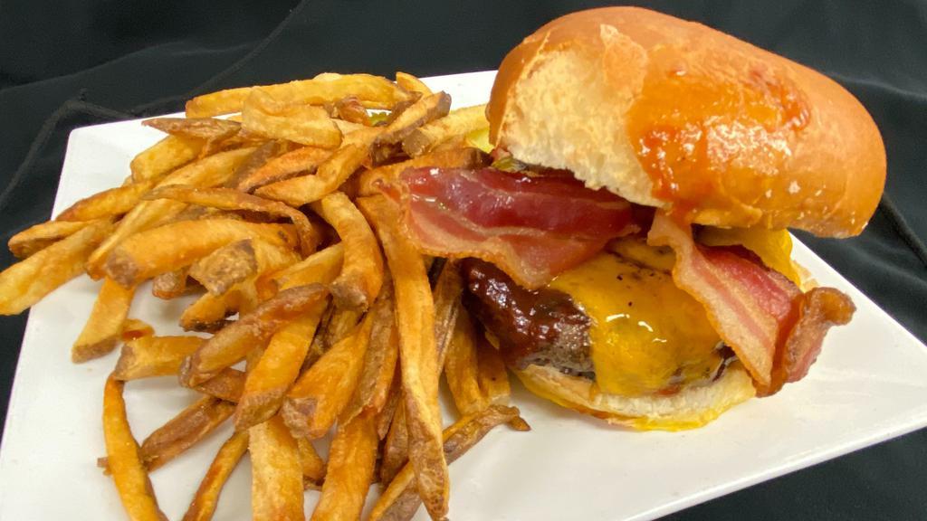 Hickory Burger · Half pound black angus beef burger, cheddar cheese, bacon and BBQ sauce.