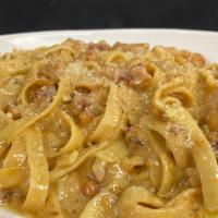 Chicken Carbonara · Roasted chicken breast atop fettuccine pasta with pancetta, tossed in house made carbonara s...