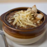 Soupe À L’Oignon · French onion soup baked with cheese.
