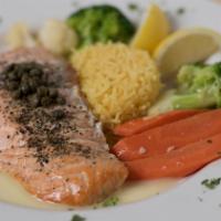 Filet De Saumon Sauce À L’Aneth · Baked filet of salmon with capers and dill in a light lemon butter sauce.