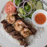 Viet Grilled Platter · Grilled pork on skewers and grilled shrimps over vermicelli and garden salad.