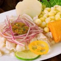 Ceviche De Pescado · Fish marinated in lime juice. Served with yams and Peruvian corn.