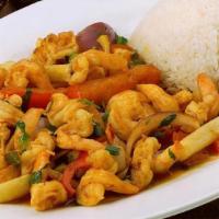 Saltado De Camaron · Shrimp sauteed with onions, tomatoes, red peppers, and French fries. Served with garlic stea...