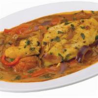 Pescado Sudado · Fish in a tomato broth stew. Served with garlic steamed rice.