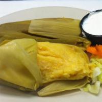 Corn Tamale · Fresh ground corn, in husks served with sour cream.