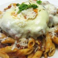 Chicken Parmesan Pasta · Breaded chicken breast with parmesan and provolone cheeses, over penne pasta with marinara s...