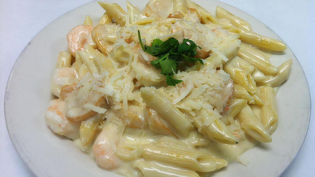 Shrimp & Scallop Alfredo · Shrimp and scallops in a creamy alfredo sauce with penne pasta.