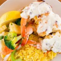 Jumbo Stuffed Shrimp · Gulf shrimp with seafood imperial, seasoned rice, and Spanish vegetables.