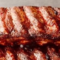 Pork Slab · St Louis cut ribs smoked slow and low over oak coals, cut, and served with our house made BB...
