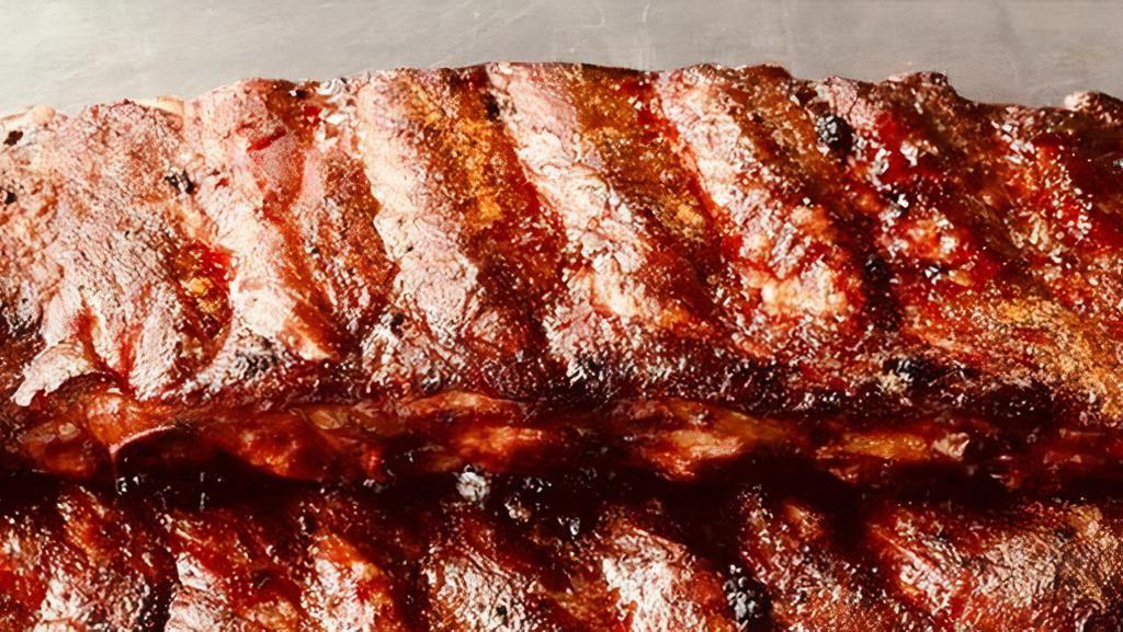 Pork Slab · St Louis cut ribs smoked slow and low over oak coals, cut, and served with our house made BBQ sauce.