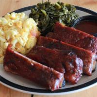 Pork Ribs Platter · St Louis cut pork ribs smoked slow and low over oak coals served with two sides and our sign...