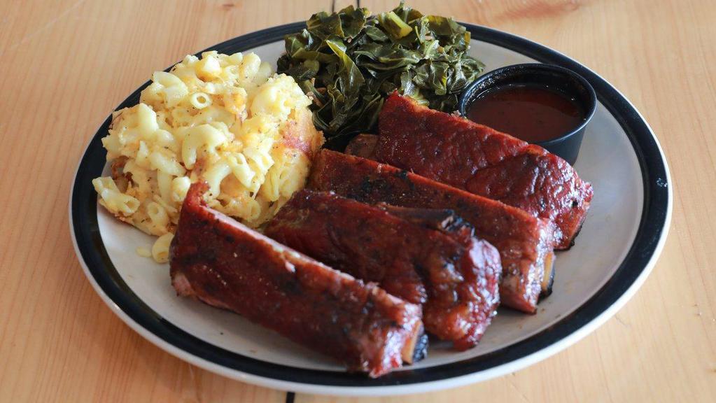 Pork Ribs Platter · St Louis cut pork ribs smoked slow and low over oak coals served with two sides and our signature BBQ sauce