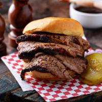 Sliced Beef Brisket Sandwich · Angus Beef Brisket smoked slow and low, sliced, and served on toasted bread with house made ...