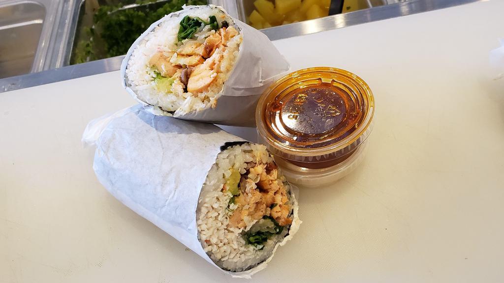 Baked Salmon Burrito · Seaweed wrapped, baked salmon, cucumber, avocado, crab, onion, spring greens, spicy mayo. Spicy mayo & eel sauce on side.