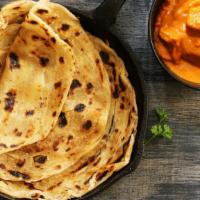 Paratha · Indian style multi-layered whole wheat bread topped with butter.