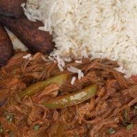 Shredded Beef Sauteed/Ropa Vieja · With peppers and onions, white rice and sweet plantains.