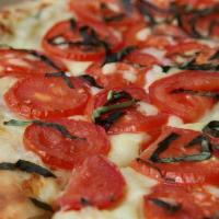 Napoli Pizza (Large) · Housemade roasted garlic sauce, mozzarella, roma tomatoes, Parmesan, fresh basil.